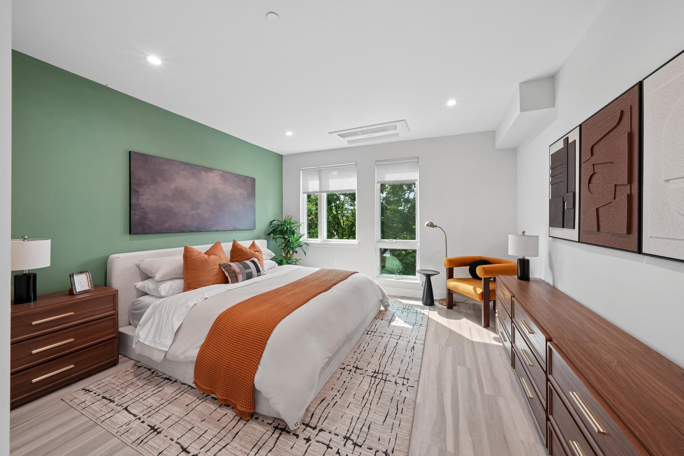 Bedroom with colorful decorations, featuring a bed, a chair, and other wardrobes.